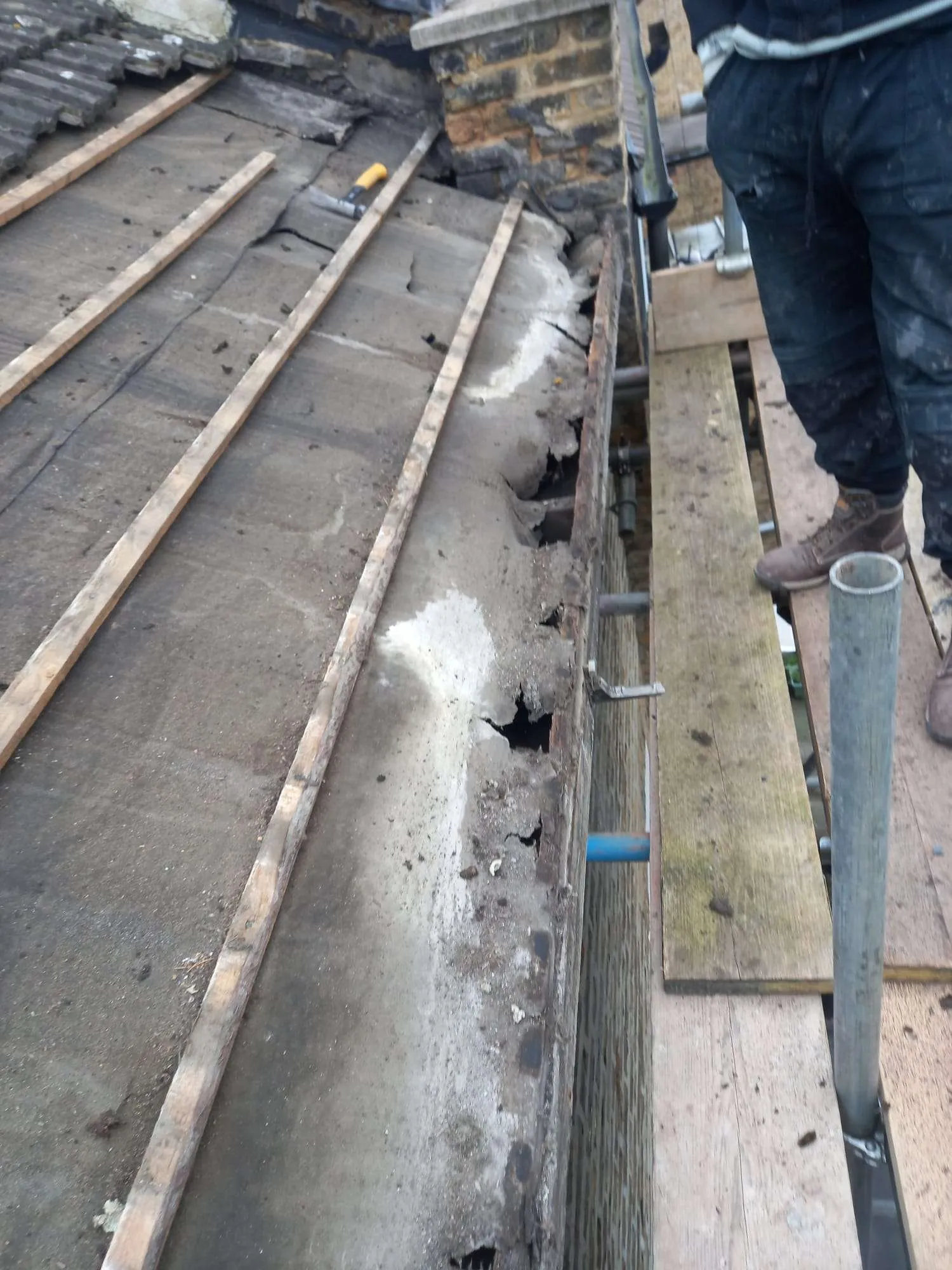 Dormer cladded with dark slate tiles on North London loft conversion