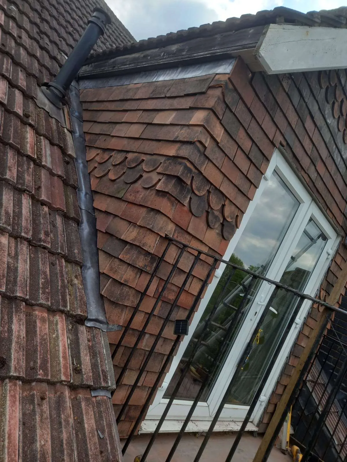 Dormer loft conversion with traditional clay tile cladding and lead flashing