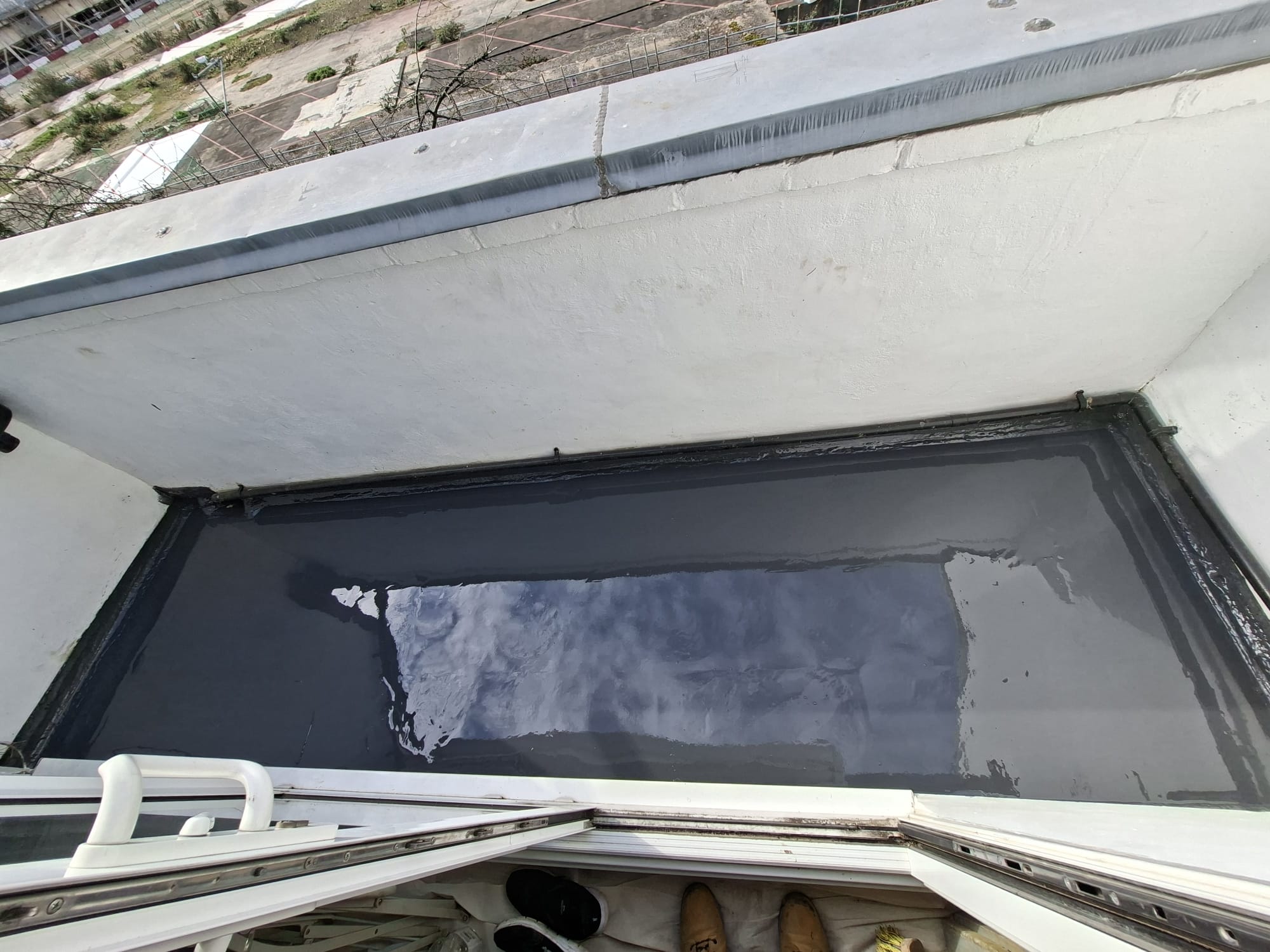 Completed flat roof balcony waterproofing with clean finish