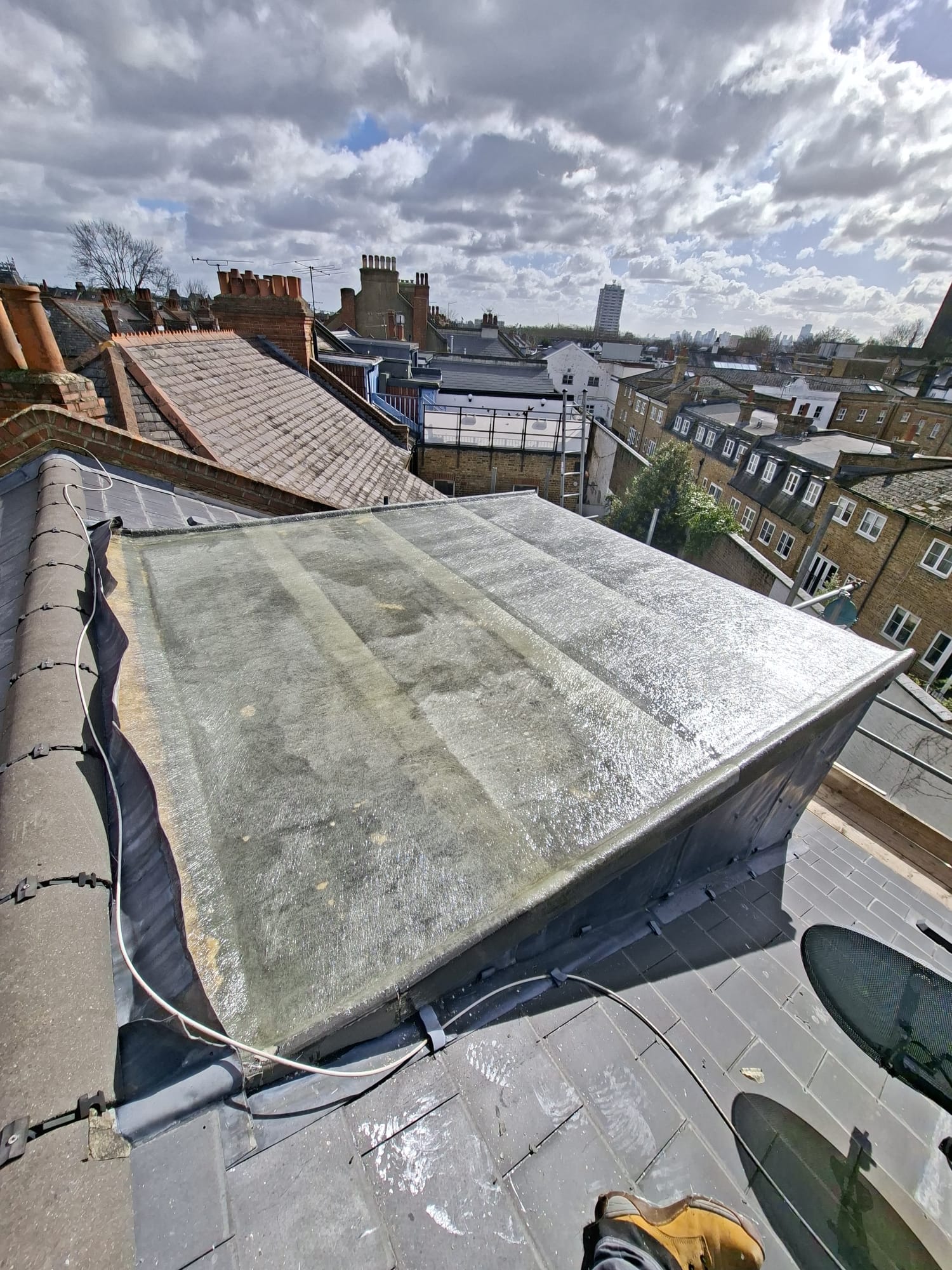 Flat roof with lead flashing detail on London residential property
