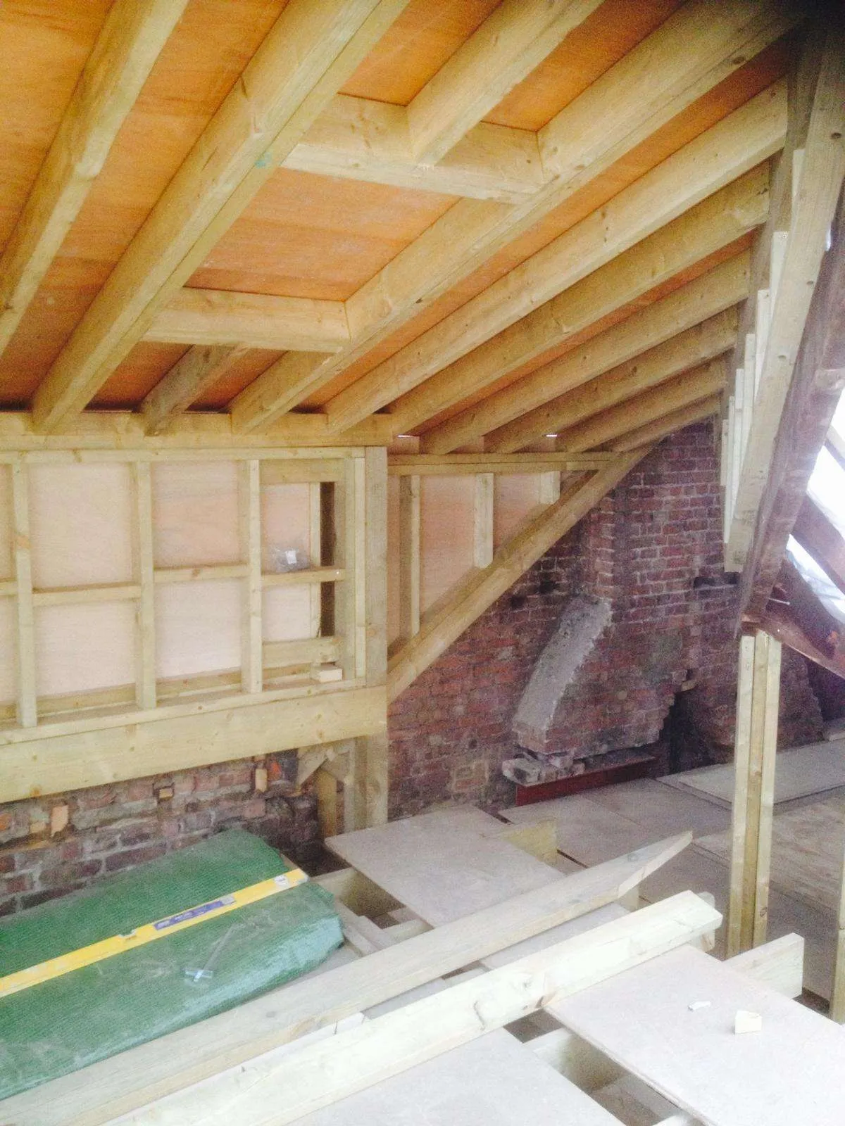 Loft conversion rafters with OSB board sheathing during construction