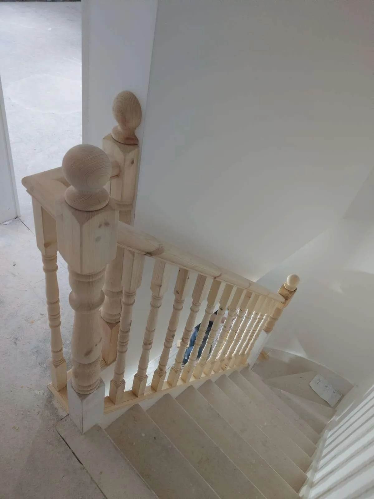 Custom pine staircase with turned balusters installed for loft conversion