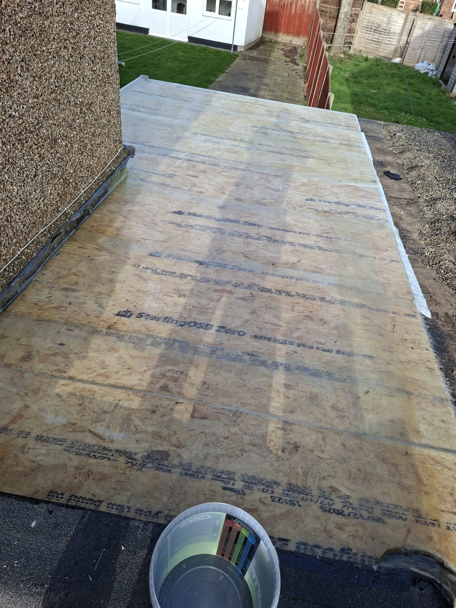 OSB board flat roof deck preparation before felt application