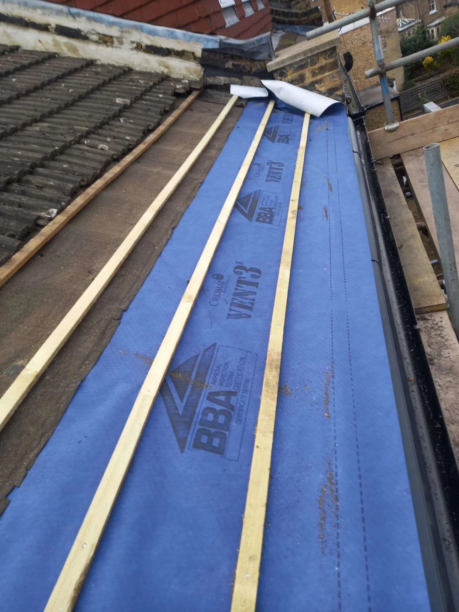 Failed roof felt with water damage — before emergency repair by AC Roofing