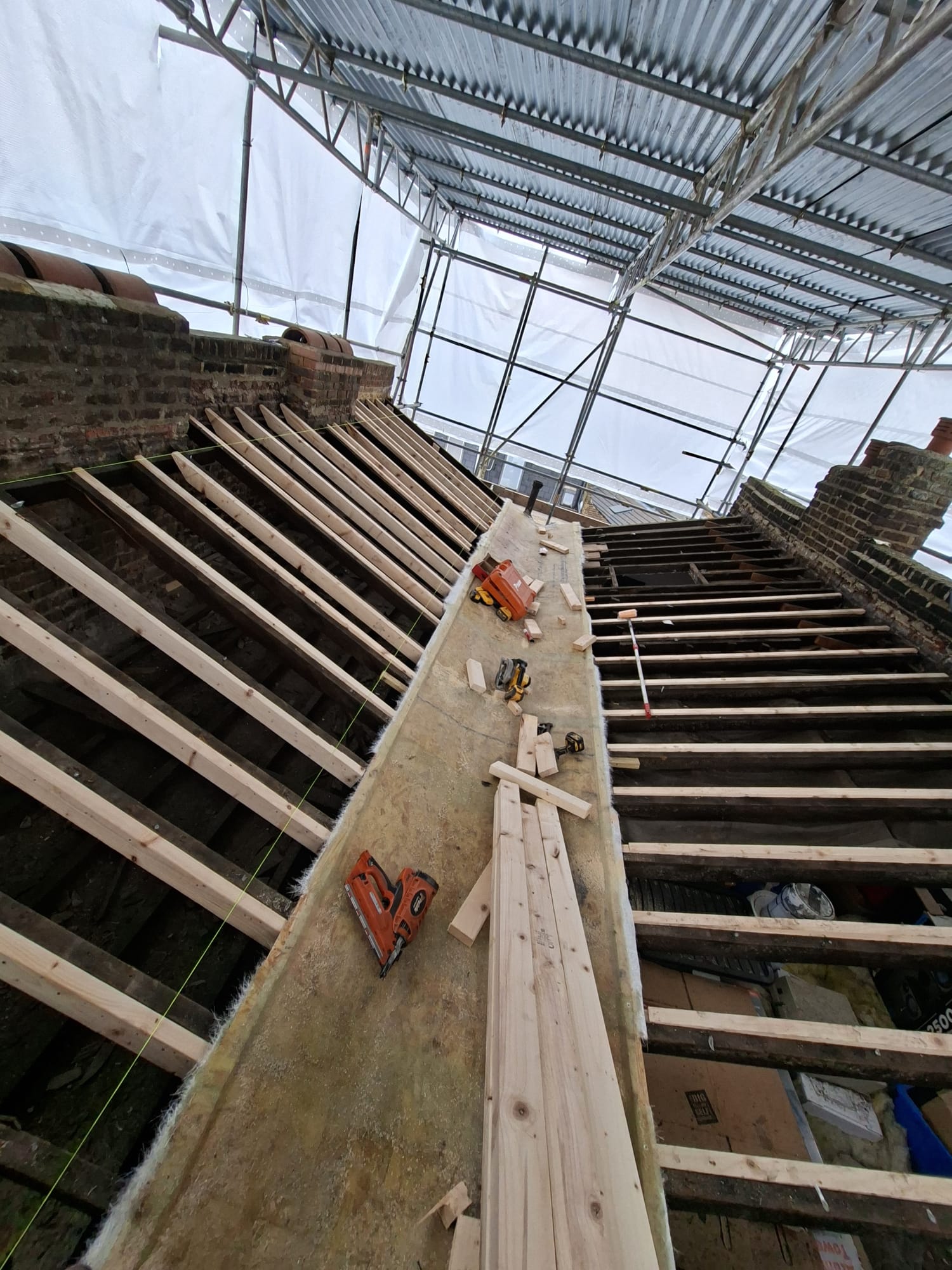 New timber roof rafters during structural roofing work