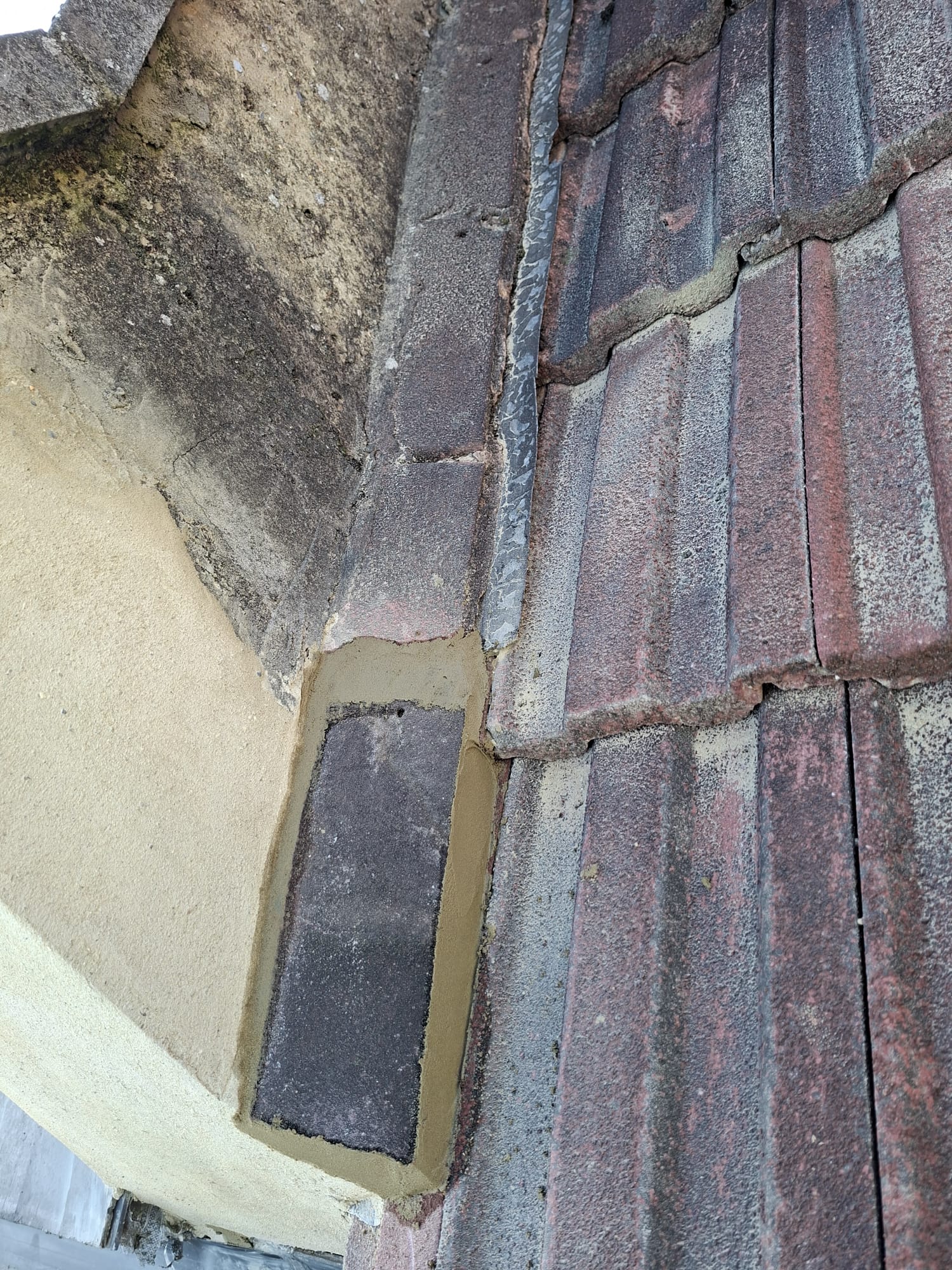 Roof tile and mortar repair on residential property
