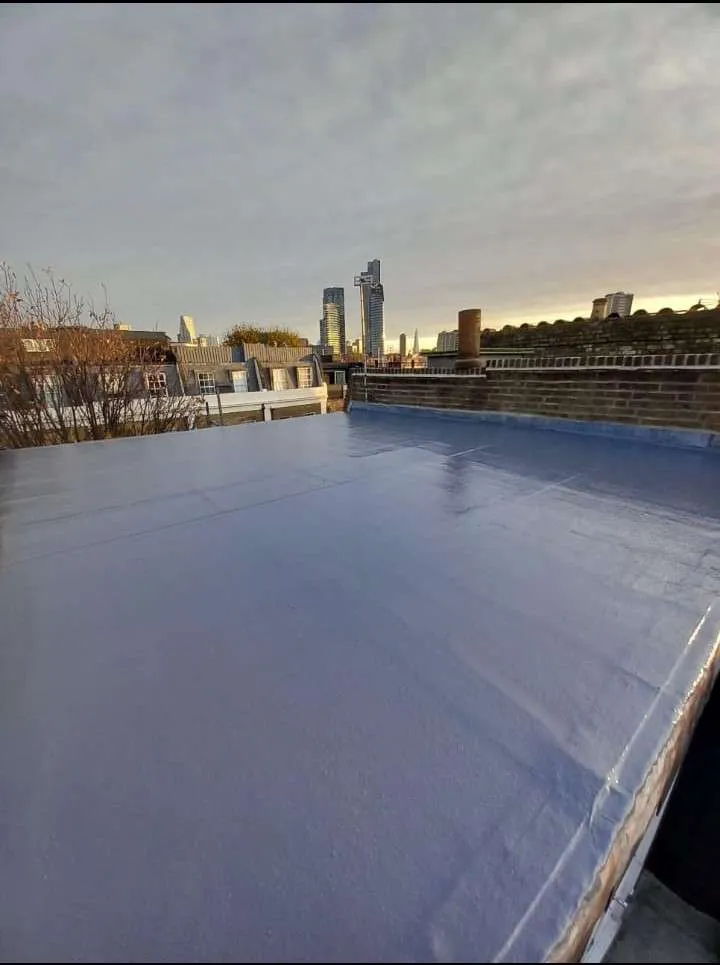 Close-up of concrete tiles and new gutter system installation